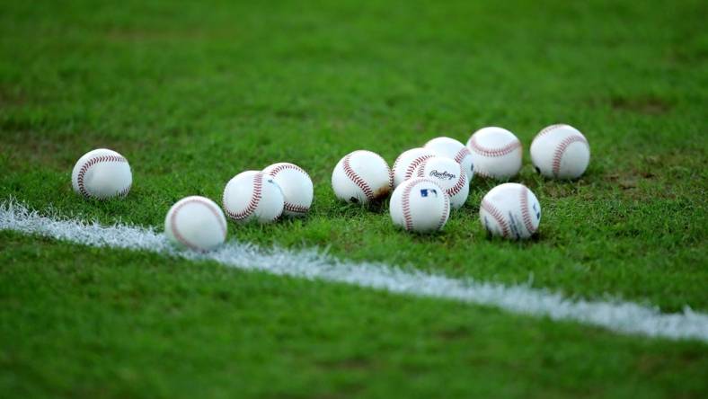 Sep 5, 2022; Houston, Texas, USA; A set of baseballs rest on the infield grass prior to the game between the Houston Astros and the Texas Rangers at Minute Maid Park. Mandatory Credit: Erik Williams-USA TODAY Sports