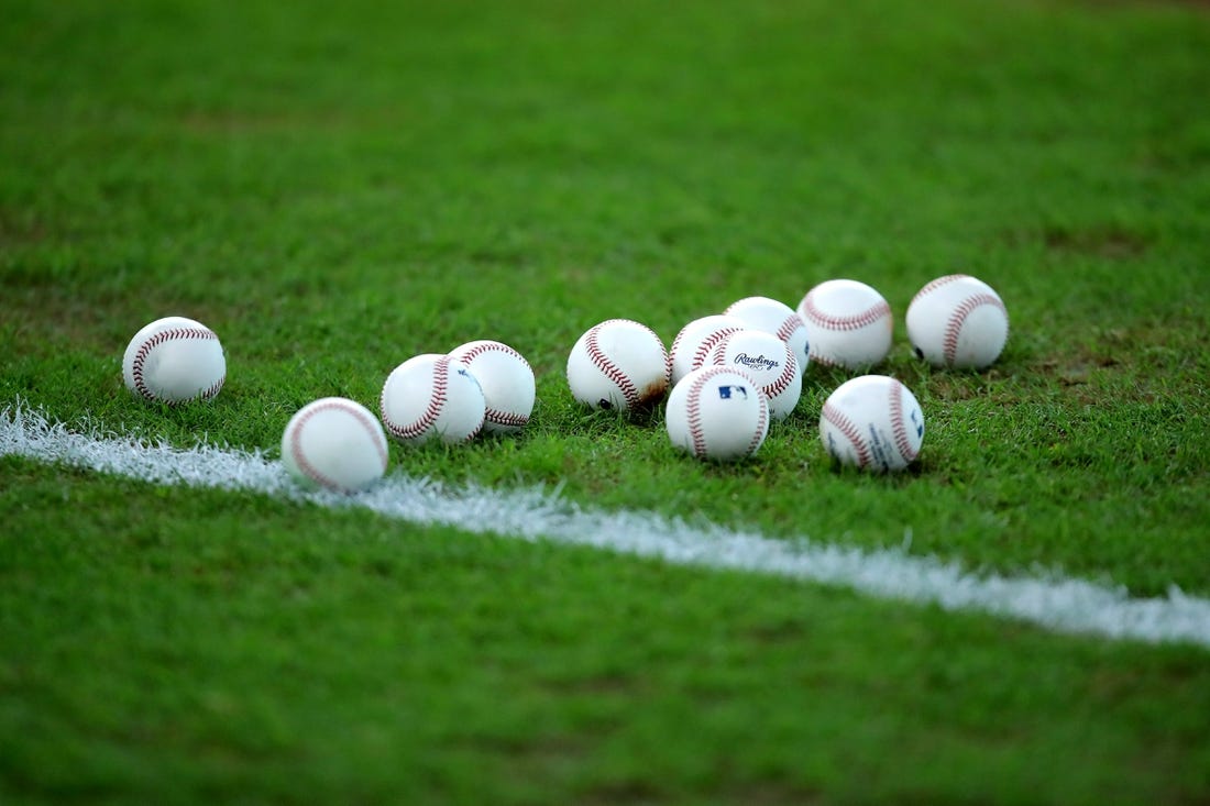 Sep 5, 2022; Houston, Texas, USA; A set of baseballs rest on the infield grass prior to the game between the Houston Astros and the Texas Rangers at Minute Maid Park. Mandatory Credit: Erik Williams-USA TODAY Sports
