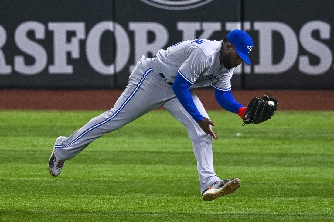 Sep 9, 2022; Arlington, Texas, USA; Toronto Blue Jays right fielder Jackie Bradley Jr. (25) catches a line drive hit by Texas Rangers designated hitter Kole Calhoun (not pictured) during the seventh inning at Globe Life Field. Mandatory Credit: Jerome Miron-USA TODAY Sports