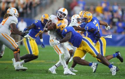 Hendon Hooker (5) of the Tennessee Volunteers gets sacked by Calijah Kancey (8) of the Pittsburgh Panthers during the second half at Acrisure Stadium in Pittsburgh, PA on Spetmebr 10, 2022.

Pittsburgh Panthers Vs Tennessee Volunteers