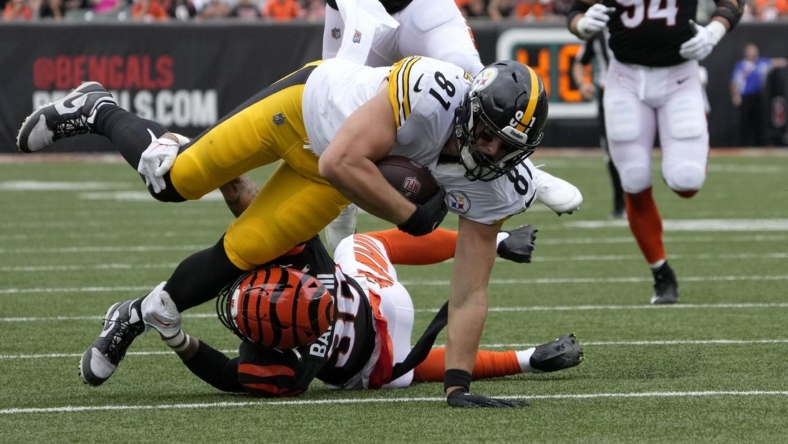 Sep 11, 2022; Cincinnati, Ohio, USA; Cincinnati Bengals safety Jessie Bates III (30) tackles Pittsburgh Steelers tight end Zach Gentry (81) during the first quarter of a Week 1 NFL football game at Paycor Stadium. Mandatory Credit: Cara Owsley-USA TODAY Sports