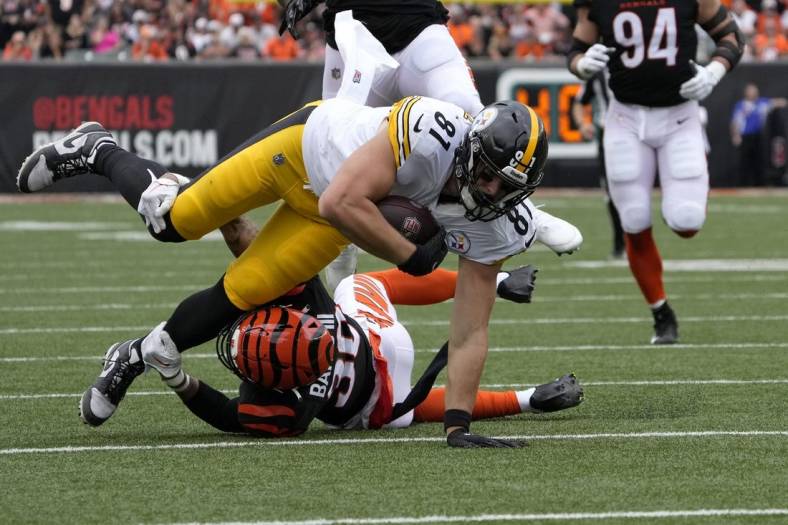Sep 11, 2022; Cincinnati, Ohio, USA; Cincinnati Bengals safety Jessie Bates III (30) tackles Pittsburgh Steelers tight end Zach Gentry (81) during the first quarter of a Week 1 NFL football game at Paycor Stadium. Mandatory Credit: Cara Owsley-USA TODAY Sports