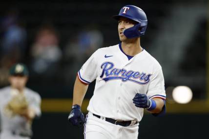 Sep 13, 2022; Arlington, Texas, USA; Texas Rangers first baseman Mark Mathias (9) rounds the bases after hitting a two run home run in the seventh inning against the Oakland Athletics at Globe Life Field. Mandatory Credit: Tim Heitman-USA TODAY Sports