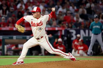 Sep 17, 2022; Anaheim, California, USA;  Los Angeles Angels relief pitcher Aaron Loup (28) pitches during the ninth inning against the Seattle Mariners at Angel Stadium. Mandatory Credit: Kiyoshi Mio-USA TODAY Sports