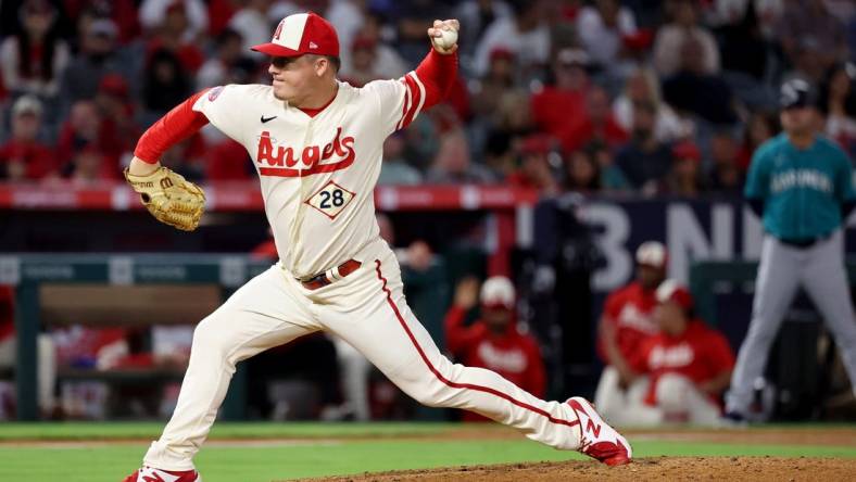 Sep 17, 2022; Anaheim, California, USA;  Los Angeles Angels relief pitcher Aaron Loup (28) pitches during the ninth inning against the Seattle Mariners at Angel Stadium. Mandatory Credit: Kiyoshi Mio-USA TODAY Sports