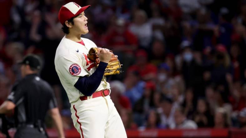 Sep 17, 2022; Anaheim, California, USA;  Los Angeles Angels starting pitcher Shohei Ohtani (17) reacts after Seattle Mariners player Adam Frazier hit into a double play during the seventh inning of a baseball game at Angel Stadium. Mandatory Credit: Kiyoshi Mio-USA TODAY Sports