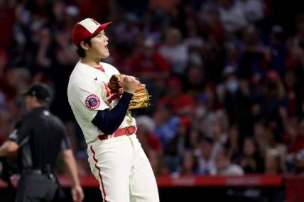 Sep 17, 2022; Anaheim, California, USA;  Los Angeles Angels starting pitcher Shohei Ohtani (17) reacts after Seattle Mariners player Adam Frazier hit into a double play during the seventh inning of a baseball game at Angel Stadium. Mandatory Credit: Kiyoshi Mio-USA TODAY Sports