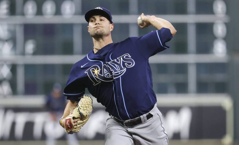 Oct 1, 2022; Houston, Texas, USA; Tampa Bay Rays starting pitcher Shane McClanahan (18) delivers a pitch during the third inning against the Houston Astros at Minute Maid Park. Mandatory Credit: Troy Taormina-USA TODAY Sports
