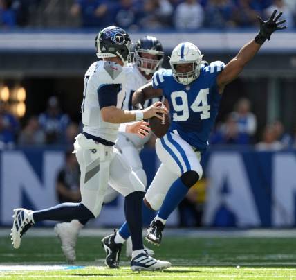 Indianapolis Colts defensive tackle Tyquan Lewis (94) pressures Tennessee Titans quarterback Ryan Tannehill (17) on Sunday, Oct. 2, 2022, during a game against the Tennessee Titans at Lucas Oil Stadium in Indianapolis.