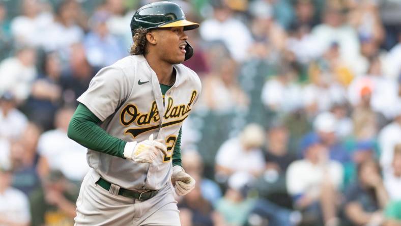 Oct 2, 2022; Seattle, Washington, USA; Oakland Athletics center fielder Cristian Pache (20) runs towards first base after walking against the Seattle Mariners during the eighth inning at T-Mobile Park. Mandatory Credit: Steven Bisig-USA TODAY Sports