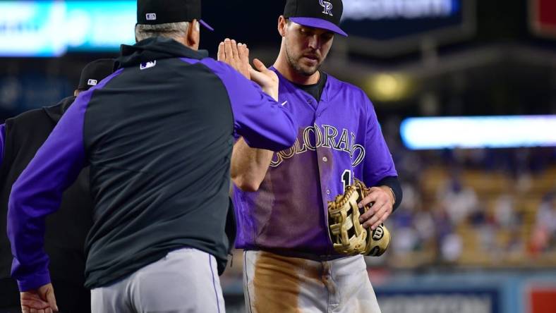 October 3, 2022; Los Angeles, California, USA; Colorado Rockies manager Bud Black (10) and left fielder Sean Bouchard (12) celebrate the victory against the Los Angeles Dodgers at Dodger Stadium. Mandatory Credit: Gary A. Vasquez-USA TODAY Sports