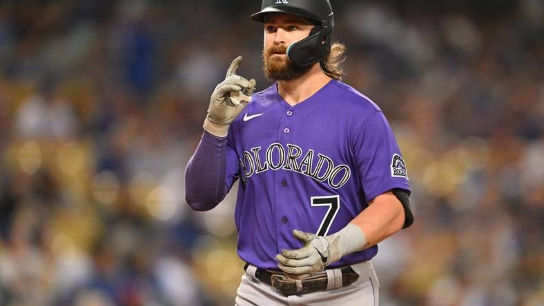 Oct 4, 2022; Los Angeles, California, USA;  Colorado Rockies second baseman Brendan Rodgers (7) crosses the plate after a solo home run in the first inning off Los Angeles Dodgers starting pitcher Julio Urias (7) at Dodger Stadium. Mandatory Credit: Jayne Kamin-Oncea-USA TODAY Sports