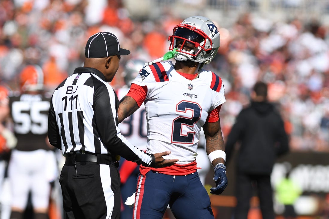 Oct 16, 2022; Cleveland, Ohio, USA; New England Patriots defensive back Jalen Mills (2) argues with the back judge after being flagged for a penalty against the Cleveland Browns in the second quarter at FirstEnergy Stadium. Mandatory Credit: Lon Horwedel-USA TODAY Sports