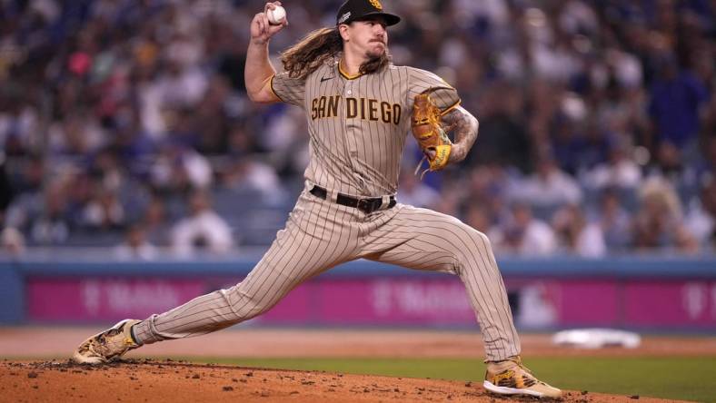 Oct 11, 2022; Los Angeles, California, USA; San Diego Padres pitcher Mike Clevinger (52) throws in the first inning of game one of the NLDS for the 2022 MLB Playoffs against the Los Angeles Dodgers at Dodger Stadium. Mandatory Credit: Kirby Lee-USA TODAY Sports