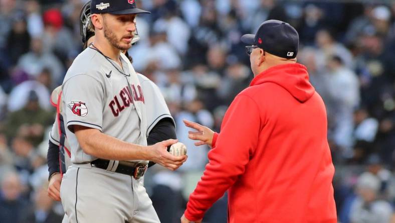 Oct 18, 2022; Bronx, New York, USA; Cleveland Guardians manager Terry Francona (77) takes relief pitcher Trevor Stephan (37) out of the game against the New York Yankees during the fifth inning in game five of the ALDS for the 2022 MLB Playoffs at Yankee Stadium. Mandatory Credit: Wendell Cruz-USA TODAY Sports