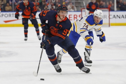 Oct 18, 2022; Edmonton, Alberta, CAN; Buffalo Sabres forward Rasmus Asplund (74) chases Edmonton Oilers forward Connor McDavid (97) up the ice during the third period at Rogers Place. Mandatory Credit: Perry Nelson-USA TODAY Sports