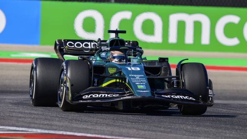 Oct 21, 2022; Austin, Texas, USA; Aston Martin Aramco Cognizant Formula One Team driver Lance Stroll (18) of Team Canada drives during practice for the U.S. Grand Prix at the Circuit of the Americas. Mandatory Credit: Jerome Miron-USA TODAY Sports