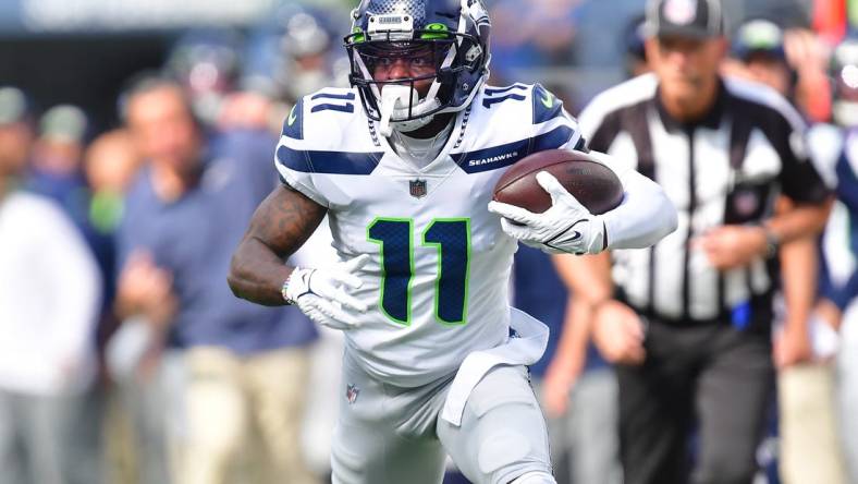 Oct 23, 2022; Inglewood, California, USA; Seattle Seahawks wide receiver Marquise Goodwin (11) runs the ball against the Los Angeles Chargers during the first half at SoFi Stadium. Mandatory Credit: Gary A. Vasquez-USA TODAY Sports