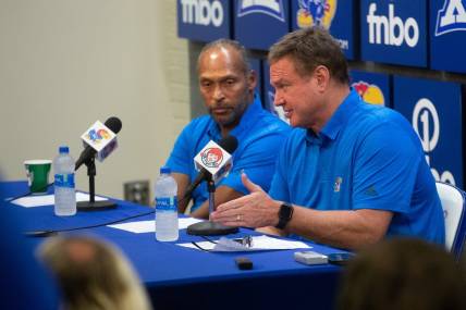 Kansas head coach Bill Self speaks with assistant coach Norm Roberts during a press conference following Thursday's game against Pitt State inside Allen Fieldhouse.