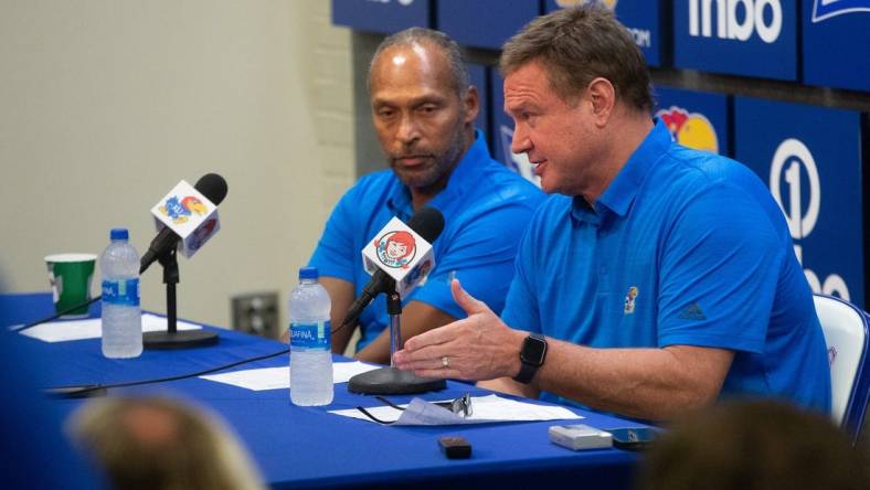 Kansas head coach Bill Self speaks with assistant coach Norm Roberts during a press conference following Thursday's game against Pitt State inside Allen Fieldhouse.