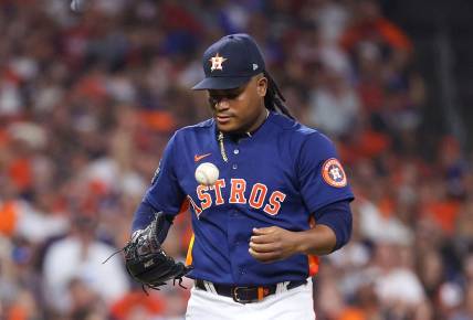 Nov 5, 2022; Houston, Texas, USA; Houston Astros starting pitcher Framber Valdez (59) flips the ball out of his glove before pitching against the Philadelphia Phillies during the second inning in game six of the 2022 World Series at Minute Maid Park. Mandatory Credit: Troy Taormina-USA TODAY Sports