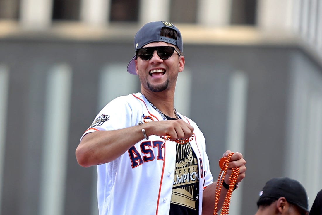 Nov 7, 2022; Houston, Texas, USA; Houston Astros first baseman Yuli Gurriel (10) throws beads to the crowd atop a parade vehicle during the Houston Astros Championship Parade in Houston, TX. Mandatory Credit: Erik Williams-USA TODAY Sports