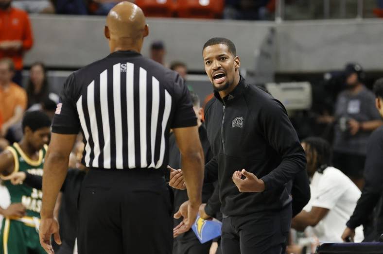 Nov 7, 2022; Auburn, Alabama, USA; George Mason Patriots head coach Kim English talks to an official during the first half against the Auburn Tigers at Neville Arena. Mandatory Credit: John Reed-USA TODAY Sports