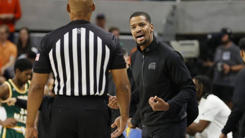 Nov 7, 2022; Auburn, Alabama, USA; George Mason Patriots head coach Kim English talks to an official during the first half against the Auburn Tigers at Neville Arena. Mandatory Credit: John Reed-USA TODAY Sports