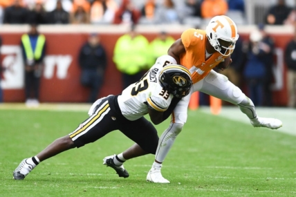 ***DUP***Tennessee quarterback Hendon Hooker (5)/Tennessee defensive back Kamal Hadden(5) is pulled down by Missouri linebacker Chad Bailey (33) during the NCAA college football game on Saturday, November 12, 2022 in Knoxville, Tenn.

Ut Vs Missouri