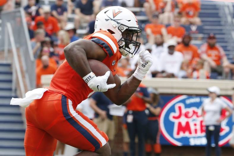 Sep 3, 2022; Charlottesville, Virginia, USA; Virginia Cavaliers running back Mike Hollins (7) carries the ball during the first half against the Richmond Spiders at Scott Stadium. Mandatory Credit: Amber Searls-USA TODAY Sports