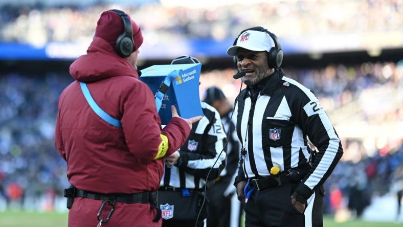 Nov 20, 2022; Baltimore, Maryland, USA; referee Jerome Boger (23) conducts instant review during the second half of the game between the Baltimore Ravens and the Carolina Panthers  at M&T Bank Stadium. Mandatory Credit: Tommy Gilligan-USA TODAY Sports