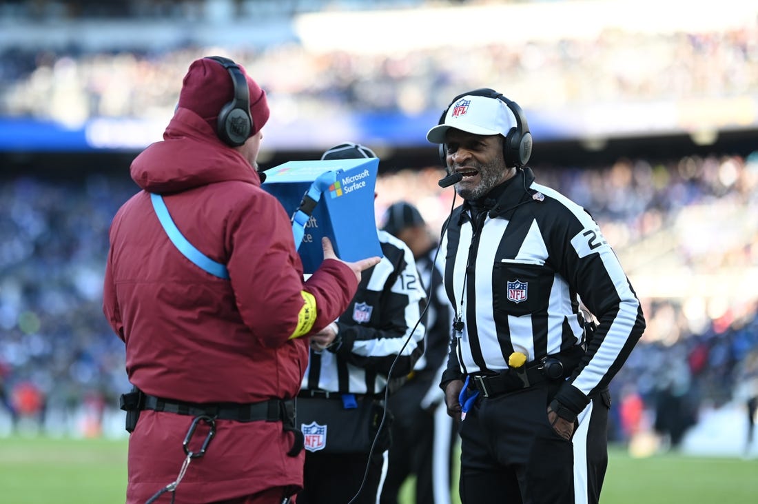 Nov 20, 2022; Baltimore, Maryland, USA; referee Jerome Boger (23) conducts instant review during the second half of the game between the Baltimore Ravens and the Carolina Panthers  at M&T Bank Stadium. Mandatory Credit: Tommy Gilligan-USA TODAY Sports