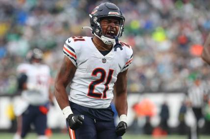 Nov 27, 2022; East Rutherford, New Jersey, USA; Chicago Bears running back Darrynton Evans (21) celebrates his run against the New York Jets during the first half at MetLife Stadium. Mandatory Credit: Ed Mulholland-USA TODAY Sports