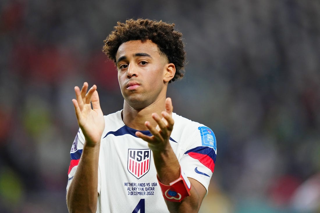 Dec 3, 2022; Al Rayyan, Qatar; United States of America midfielder Tyler Adams (4) acknowledges fans after losing a round of sixteen match against the Netherlands in the 2022 FIFA World Cup at Khalifa International Stadium. Mandatory Credit: Danielle Parhizkaran-USA TODAY Sports