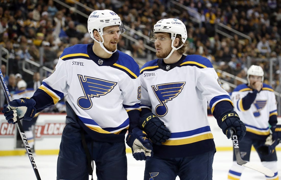 Dec 3, 2022; Pittsburgh, Pennsylvania, USA;  St. Louis Blues left wing Pavel Buchnevich (89) and center Robert Thomas (right) talk during a time-out against the Pittsburgh Penguins in the first period at PPG Paints Arena. Mandatory Credit: Charles LeClaire-USA TODAY Sports