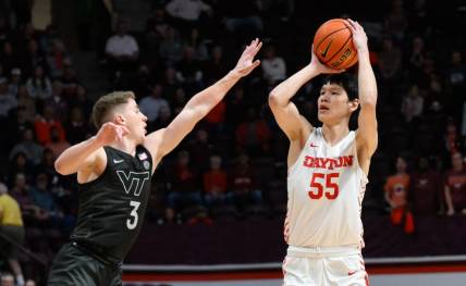 Dec 7, 2022; Blacksburg, Virginia, USA; Dayton Flyers forward Mike Sharavjamts (55) shoots over Virginia Tech Hokies guard Sean Pedulla (3) at Cassell Coliseum. Mandatory Credit: Lee Luther Jr.-USA TODAY Sports