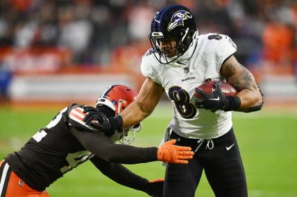 Dec 17, 2022; Cleveland, Ohio, USA; Cleveland Browns linebacker Tony Fields II (42) tackles Baltimore Ravens tight end Josh Oliver (84) during the first quarter at FirstEnergy Stadium. Mandatory Credit: Ken Blaze-USA TODAY Sports