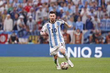 Dec 18, 2022; Lusail, Qatar; Argentina forward Lionel Messi (10) dribbles the ball against France during the first half of the 2022 World Cup final at Lusail Stadium. Mandatory Credit: Yukihito Taguchi-USA TODAY Sports