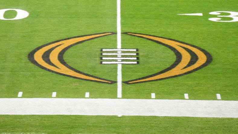 Dec 30, 2022; Glendale AZ, USA; The College Football Playoff logo on the field at State Farm Stadium, the site of the 2022 CFP Semifinal between the TCU Horned Frogs and the Michigan Wolverines and Super Bowl 57 (LVII). Mandatory Credit: Kirby Lee-USA TODAY Sports