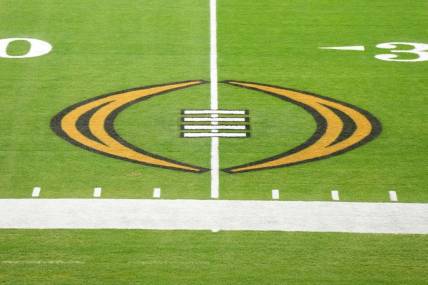 Dec 30, 2022; Glendale AZ, USA; The College Football Playoff logo on the field at State Farm Stadium, the site of the 2022 CFP Semifinal between the TCU Horned Frogs and the Michigan Wolverines and Super Bowl 57 (LVII). Mandatory Credit: Kirby Lee-USA TODAY Sports