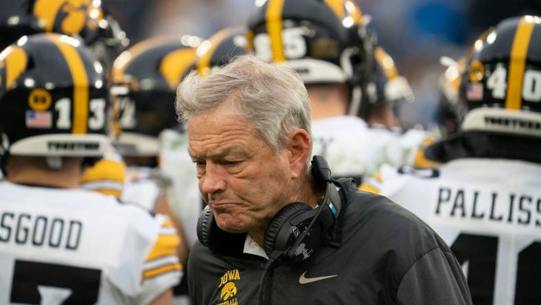 Iowa head coach Kirk Ferentz walks to the sideline during a timeout in the third quarter of the TransPerfect Music City Bowl game against Kentucky at Nissan Stadium Saturday, Dec. 31, 2022, in Nashville, Tenn. Iowa defeated Kentucky 21 to 0 in the first shutout in bowl history.

Ncaa Football Music City Bowl Iowa At Kentucky