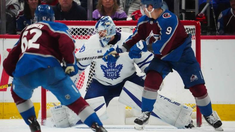 Dec 31, 2022; Denver, Colorado, USA; Toronto Maple Leafs goaltender Matt Murray (30) makes a save against Colorado Avalanche center Evan Rodrigues (9) in the third period at Ball Arena. Mandatory Credit: Ron Chenoy-USA TODAY Sports