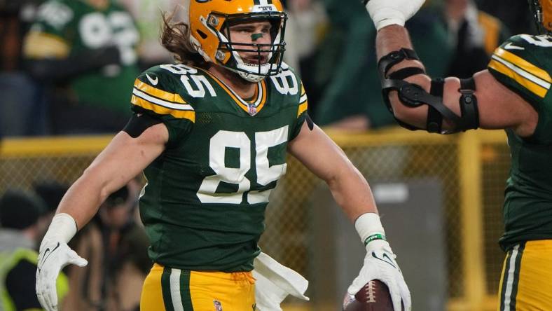 Jan 1, 2023; Green Bay, Wisconsin, USA; Green Bay Packers tight end Robert Tonyan (85) celebrates a touchdown reception during the third quarter of their game against the Minnesota Vikings at Lambeau Field. Mandatory Credit: Mark Hoffman-USA TODAY Sports