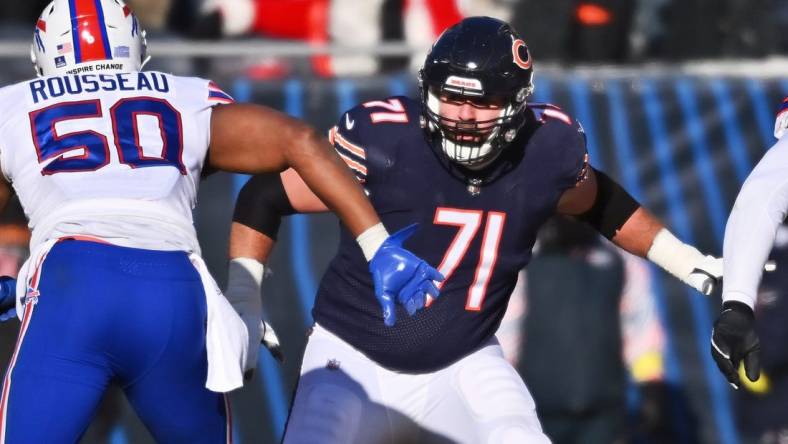 Dec 24, 2022; Chicago, Illinois, USA;  Chicago Bears offensive lineman Riley Reiff (71) blocks against the Buffalo Bills at Soldier Field. Mandatory Credit: Jamie Sabau-USA TODAY Sports