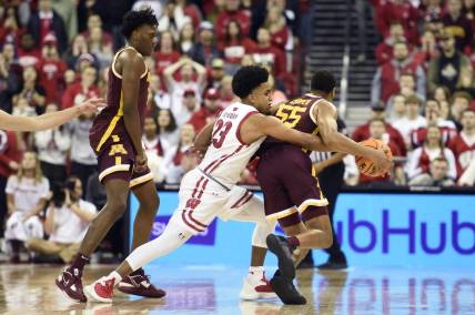 Jan 3, 2023; Madison, Wisconsin, USA;   Wisconsin Badgers guard Chucky Hepburn (23) attempts to steal the ball from Minnesota Golden Gophers guard Ta'lon Cooper (55) in the second half at the Kohl Center. Mandatory Credit: Kayla Wolf-USA TODAY Sports