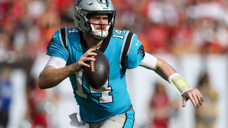 Jan 1, 2023; Tampa, Florida, USA;  Carolina Panthers quarterback Sam Darnold (14) looks to pass against the Tampa Bay Buccaneers in the third quarter at Raymond James Stadium. Mandatory Credit: Nathan Ray Seebeck-USA TODAY Sports