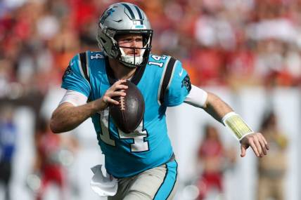 Jan 1, 2023; Tampa, Florida, USA;  Carolina Panthers quarterback Sam Darnold (14) looks to pass against the Tampa Bay Buccaneers in the third quarter at Raymond James Stadium. Mandatory Credit: Nathan Ray Seebeck-USA TODAY Sports
