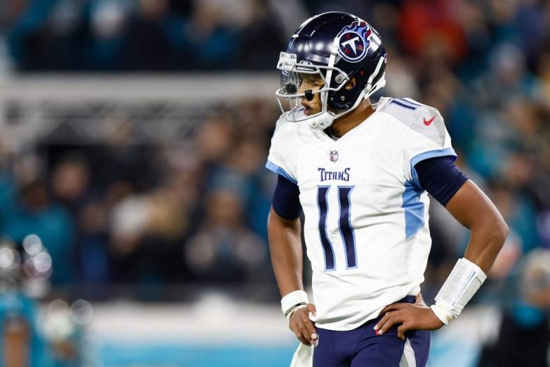 Jan 7, 2023;  Jacksonville, Florida, USA; Tennessee Titans quarterback Joshua Dobbs (11) reacts after giving up a fumble for a touchdown to Jacksonville Jaguars linebacker Josh Allen (41) during the fourth quarter at TIAA Bank Field. Mandatory Credit: Douglas DeFelice-USA TODAY Sports
