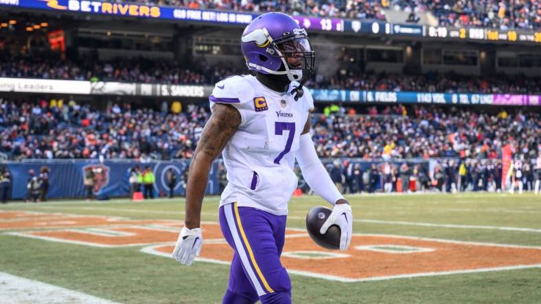 Jan 8, 2023; Chicago, Illinois, USA; Minnesota Vikings cornerback Patrick Peterson (7) celebrates his interception during the second quarter against the Chicago Bears at Soldier Field. Mandatory Credit: Daniel Bartel-USA TODAY Sports