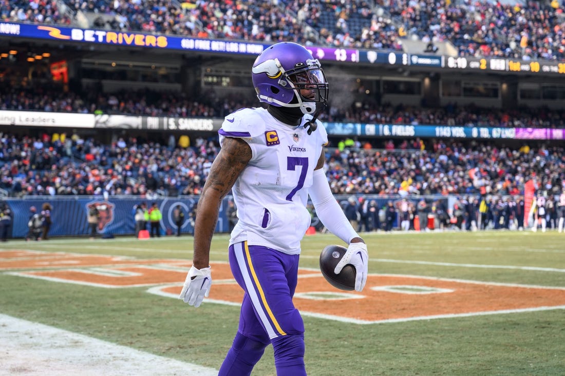 Jan 8, 2023; Chicago, Illinois, USA; Minnesota Vikings cornerback Patrick Peterson (7) celebrates his interception during the second quarter against the Chicago Bears at Soldier Field. Mandatory Credit: Daniel Bartel-USA TODAY Sports